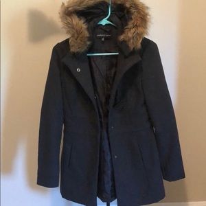 Thigh length coat with detachable hood.